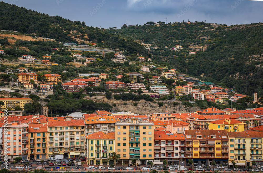 Fototapeta premium Colorful Mediterranean houses along Roya river in old town Ventimiglia, Italy