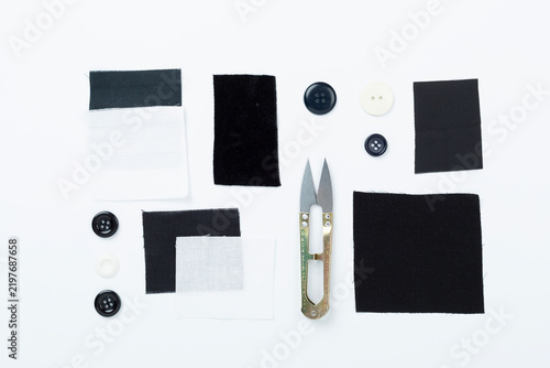 Sewing and needlework accessories on color background, top view