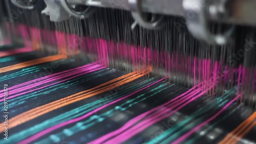 Industrial loom weaving colorful threads