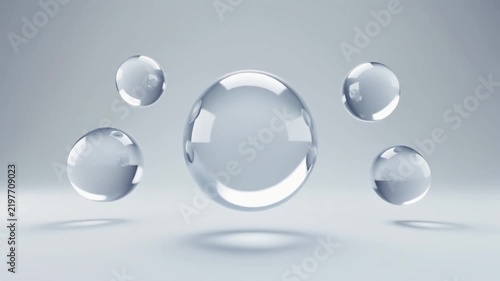 Abstract 3D rendering with transparent glass spheres floating in a clean studio environment