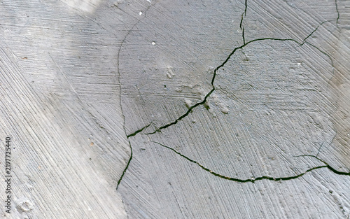 Fotografie Cracked gray concrete plaster wall with diagonal rough brush texture