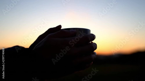 Silhouette Hands Holding Mug At Sunset. 4K Video