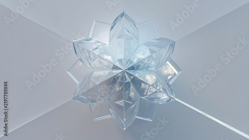 Transparent glass geometric star shape reflecting light on a pale background