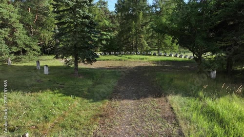 Aerial Torun Poland Soviet soldiers cemetery forest descend 2. Stalag XXI-C was a German Army World War II prisoner of war camp. Memorial is mass graves of over 14,000 prisoners executed. Historical.