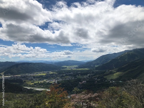 Bild auf Leinwand Scenic valley and city view from a mountain overlook