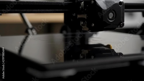 3D printer head creating object while precision technology works on manufacturing and innovation with a modern industrial mood
