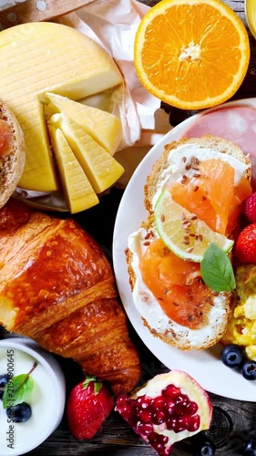 Gourmet brunch table layout with croissant salmon toast cheese and fresh fruit