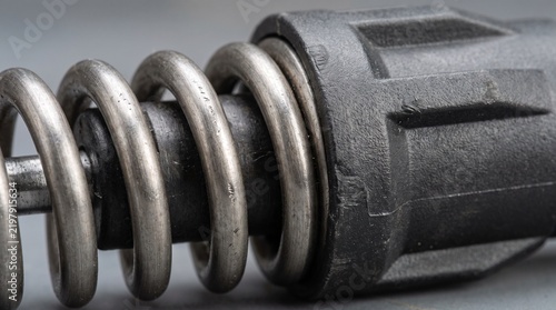 Close up shot of mechanical metal spring and component part