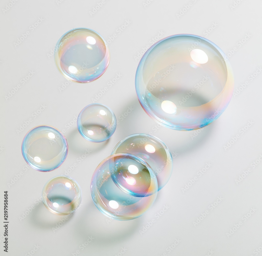 Fototapeta premium Colorful soap bubbles floating against white background