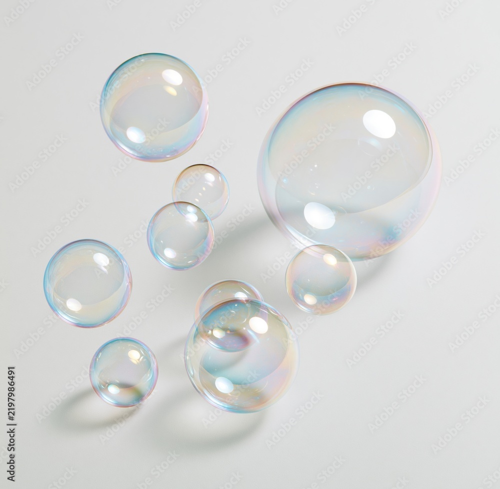 Fototapeta premium Colorful iridescent soap bubbles on white background