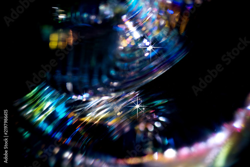 Lights blurred background, motion colorful bokeh, glowing background. Holiday city abstract defocused colorful backdrop. Bright vivid blurred colourful New Year holiday bokeh