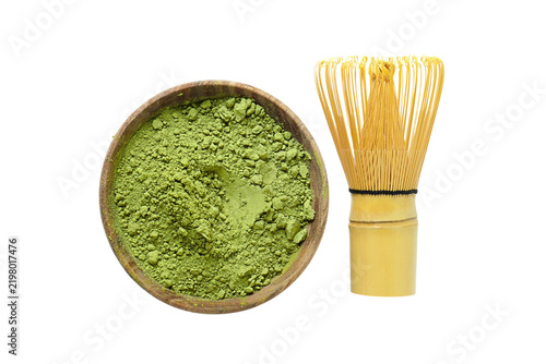 Matcha. Bowl filled with vibrant matcha powder beside bamboo whisk. PNG