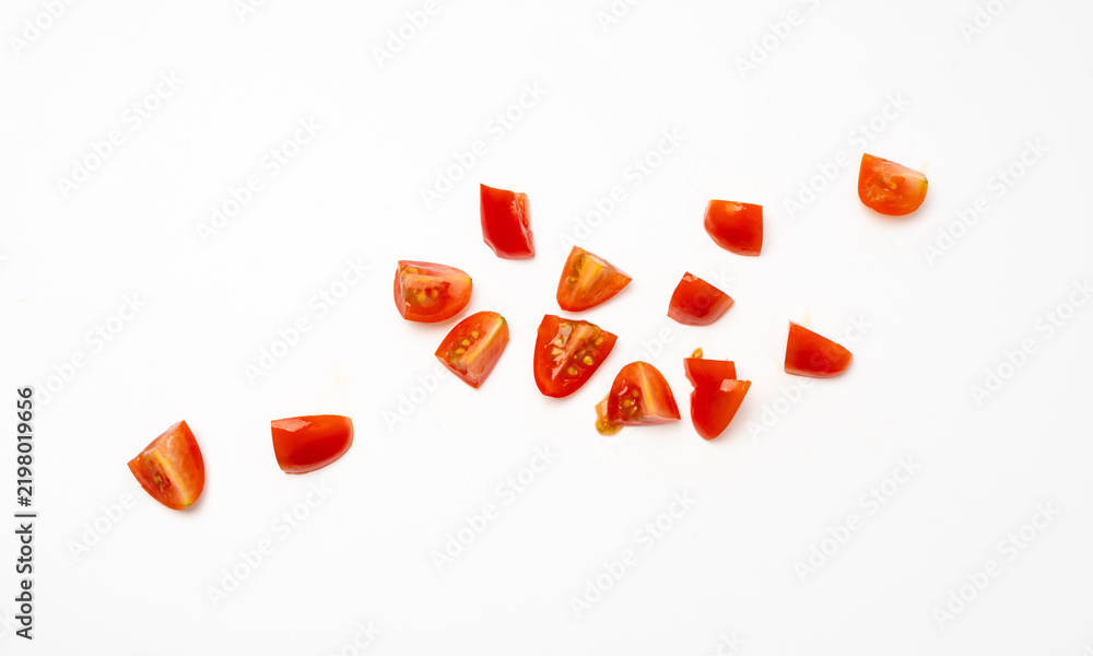 Fototapeta premium Chopped tomato isolated, cherry tomatoes