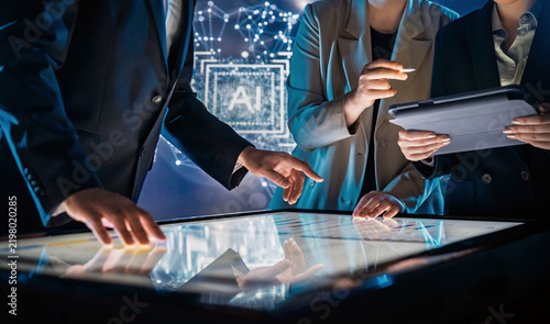 Business Team Collaborating on Interactive Touchscreen Table in Futuristic Office