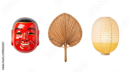 Red Japanese Hannya mask, woven fan, and paper lantern isolated