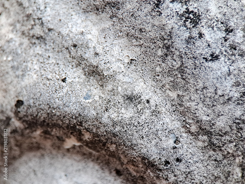 Konstfotografi Macro view of weathered concrete surface with dark mineral deposits
