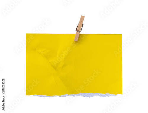 crumpled yellow sticky note with pushpin