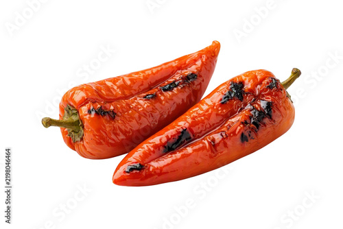 Two grilled red sweet peppers with char marks isolated on transparent background. Roasted organic bell pepper pods, delicious cooked vegetable ingredient  for culinary design.