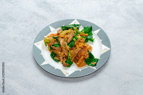 Wide flat rice noodles stir-fried in a hot wok with egg, Chinese broccoli (Gai Lan), and your choice of meat, tossed in a sweet and savory dark soy sauce with a distinct smoky wok aroma.