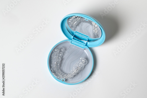 Clear aligners in blue case for orthodontics and dental care