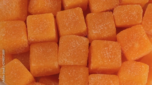 Zoom frame yellow cubes creatine gummies close up, rotation