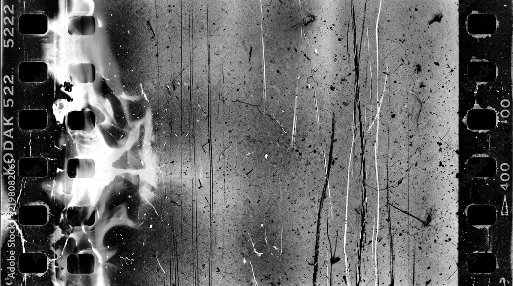 Fototapeta premium Old film texture with scratches, noise and light leaks. Realistic transparent overlay film texture in black-white, dust and grain. Distressed retro movie or photo negative effect of cinema nostalgia