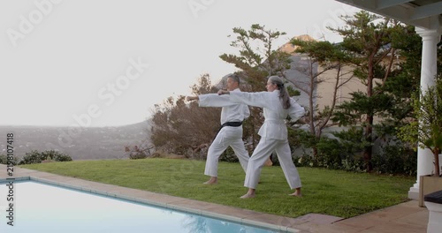 Lifestyle videos outdoor of people doing activities, practicing martial arts, couple in white unifor