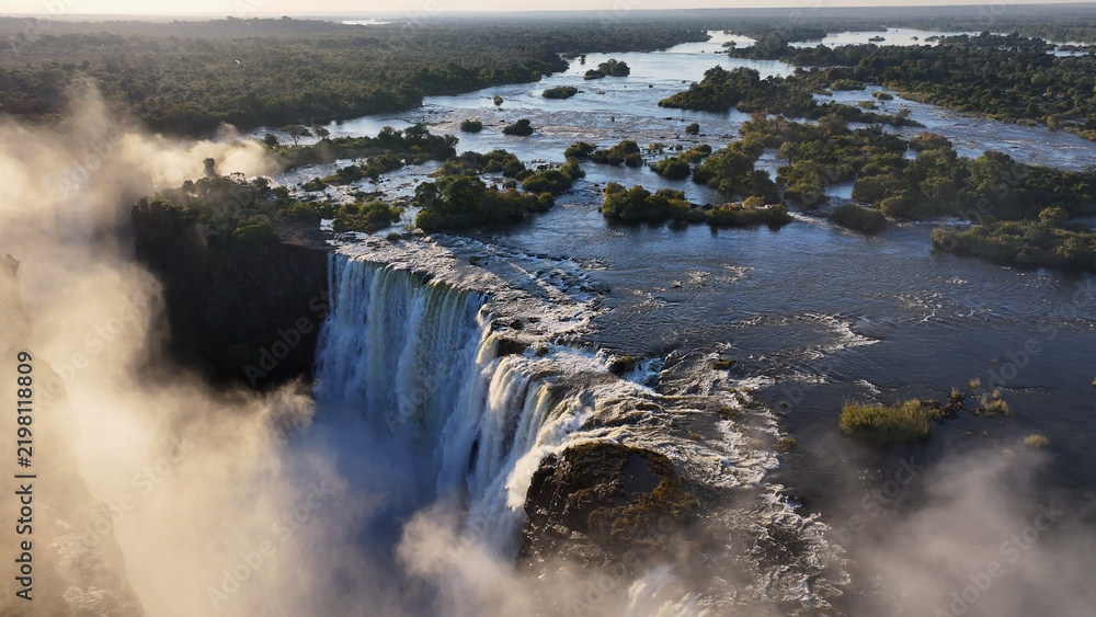 Obraz premium Scenic Water Falls At Victoria Falls In Matabeleland North Zimbabwe. Nature Waterfall. Zambezi River Landscape. Victoria Falls At Matabeleland North Zimbabwe. Southern Africa. Tourism Travel.