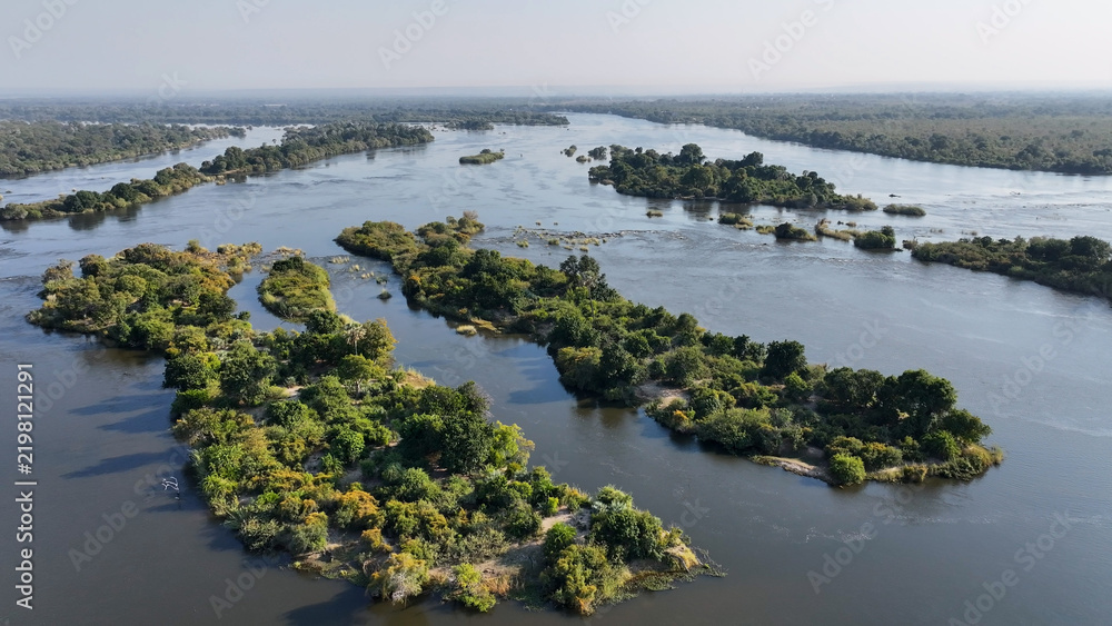 Obraz premium Zimbabwe Skyline At Livingstone In Northern Rhodesia Zambia. Giant Waterfalls. Nature Landscape. Livingstone At Northern Rhodesia Zambia. Zambezi River. Travel Scenery.