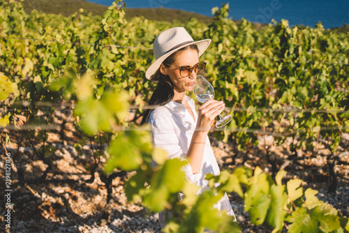 Female tourist drinking wine at winery
