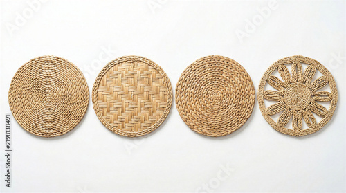 Four round woven placemats with distinct natural textures arranged on a clean white background