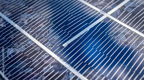 Modern blue solar panel cell surface showing intricate conductive metal grid lines under bright natural sunlight in high quality detail