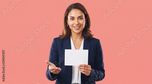 Man Checking Smartphone While Holding Business Documents