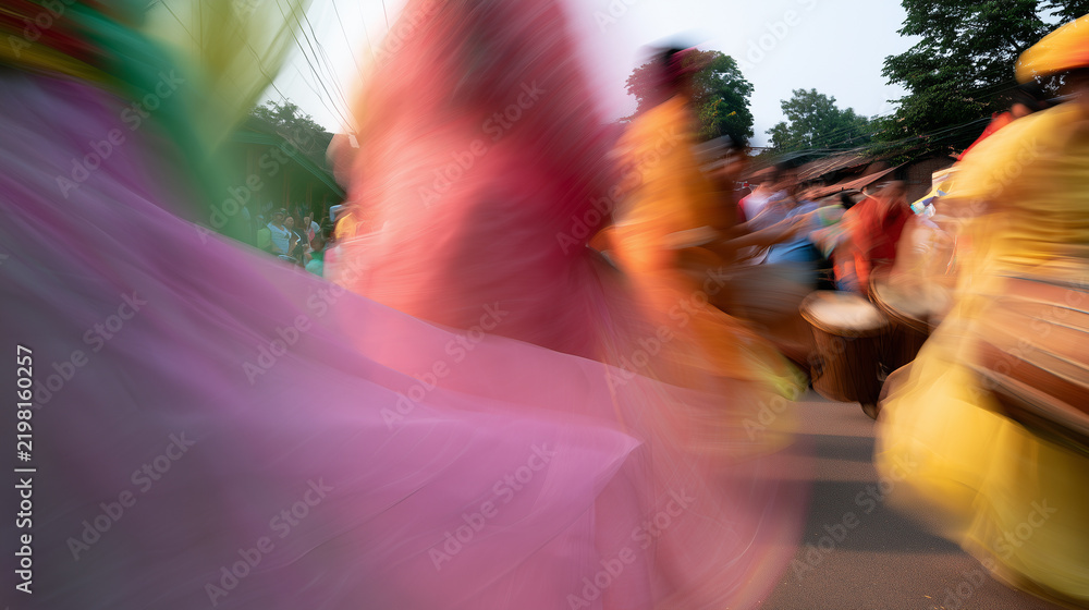 Fototapeta premium Vibrant Motion Blur Captures the Energetic Spirit and Cultural Rhythm of the Traditional Street Parade at the Annual Carnaval de San Miguel Celebration