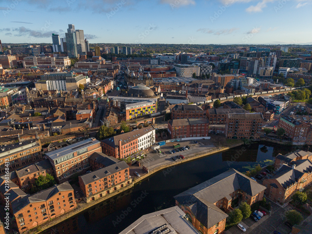 Fototapeta premium Aerial Image of River Aire Waterfront, The Calls, and Leeds Skyline at Sunrise