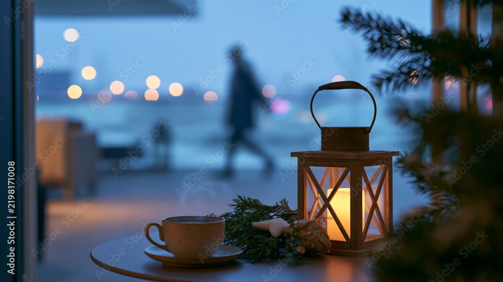 Obraz premium Luxury Christmas Balcony at Blue Hour with Lantern, Evergreen Branch and Steaming Cup, Premium Winter Travel Advertising Photography