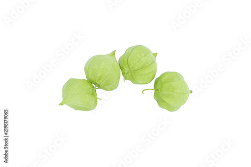 Group of four fresh green tomatillos in husks on png background composition