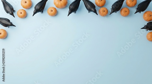 Black ravens and orange pumpkins border on a light blue background