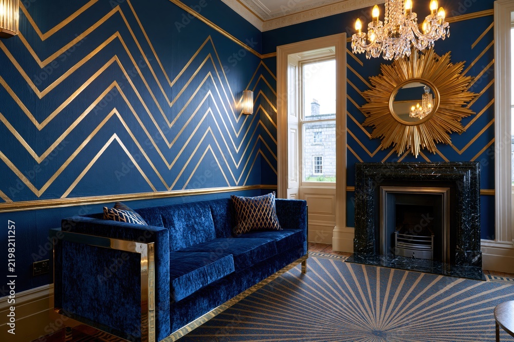 Obraz premium Luxurious blue velvet sofa in art deco room