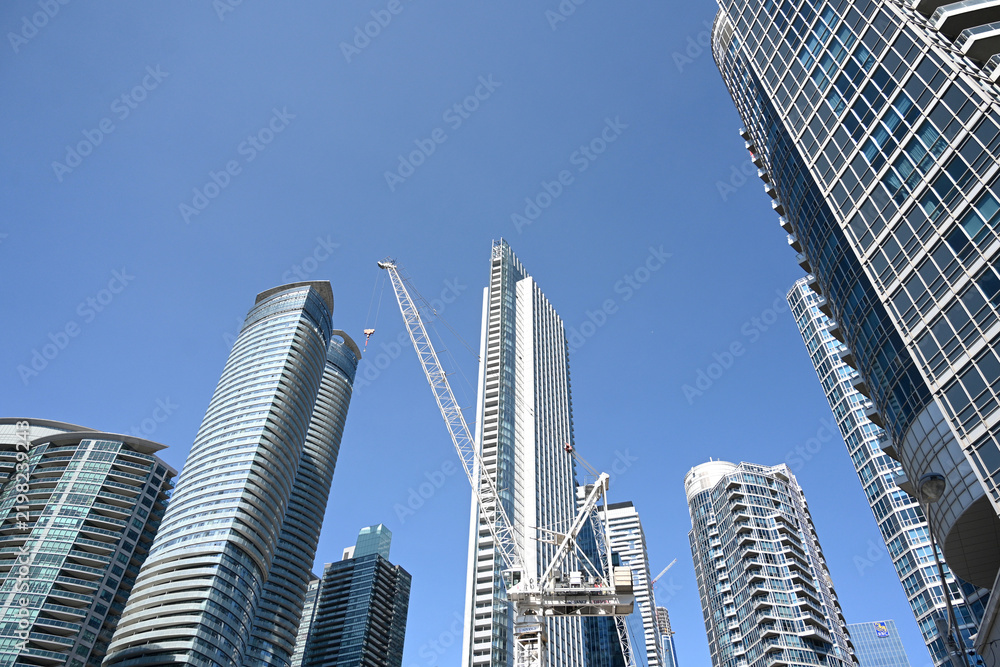 Obraz premium Toronto, Ontario, Canada - June 28, 2026: Construction crane and skyscrapers in Toronto.