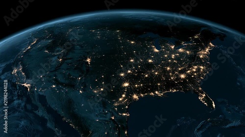 Aerial view of the United States at night showing city lights and landmarks