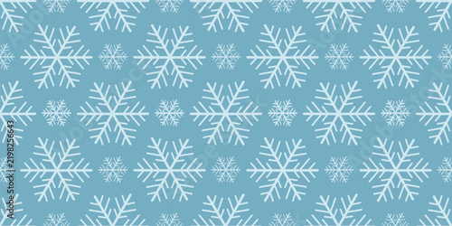 Seamless winter pattern with white snowflakes for  textile design, and seasonal decoration