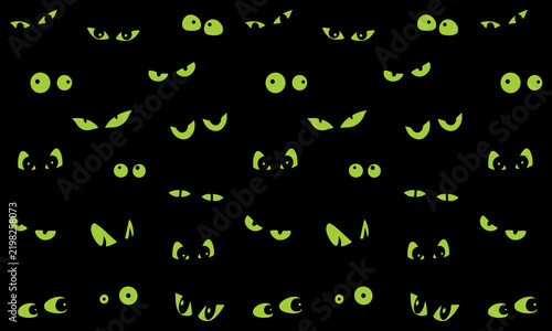 Fotografie Eerie black background filled with glowing green monster eyes in various shapes and sizes for halloween horror designs