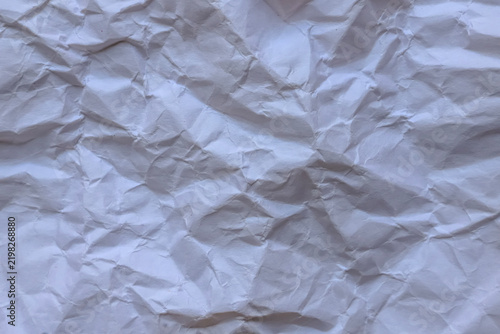 Fotografía Crumpled off-white paper texture background with soft natural lighting and warm