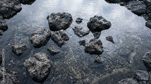 Top view of volcanic rocks in a crystal clear rock pool