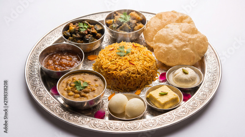 Silver thali filled with Durga Puja Maha Bhog offerings,