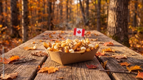 Canadian poutine served on a rustic picnic table in an autumn forest.