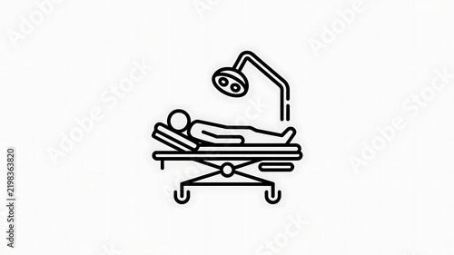 Patient lying on a hospital bed with surgical light icon