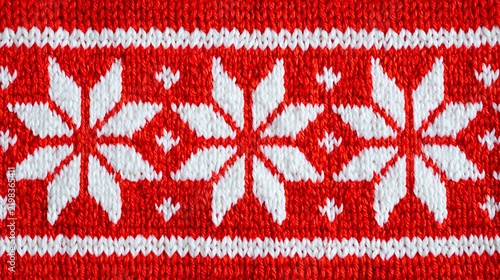 Authentic cozy winter textile background hand knitted red wool featuring traditional red and white patterned ornaments stars snowflakes flat lay stock imagery.