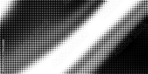 Abstract black and white dotted halftone texture background.